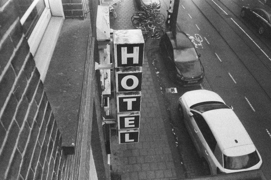Hotel sign seen from above the street, 35mm
