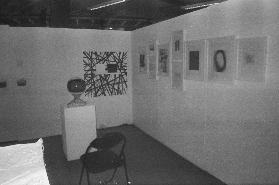 Framed prints hung in a gallery, 35mm