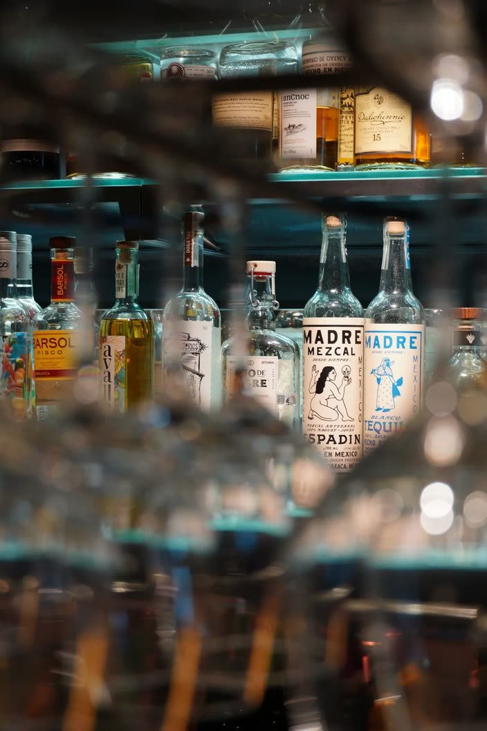 Crabshakk — the back bar through the glassware