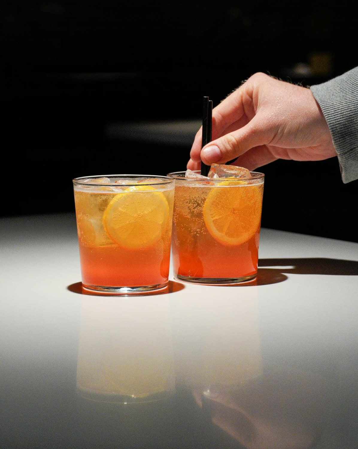 Crabshakk — two aperitifs on a dark counter
